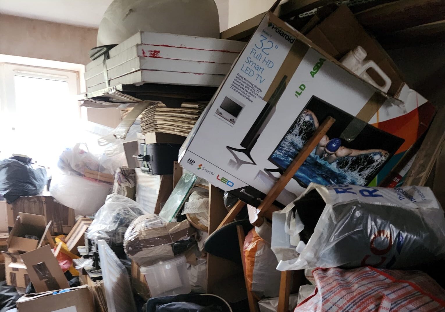 Large pile of personal belongings stored from a hoarding clearance