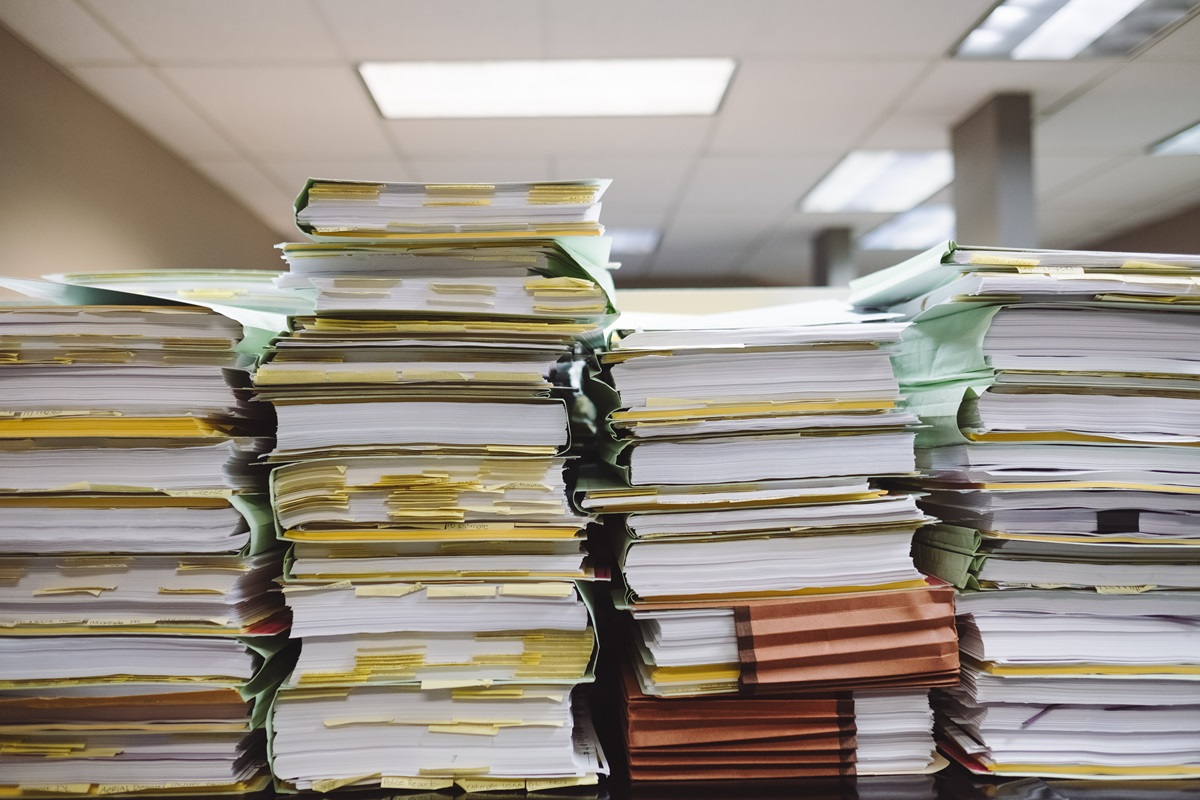 Piles of anonymous files and folders in an office setting