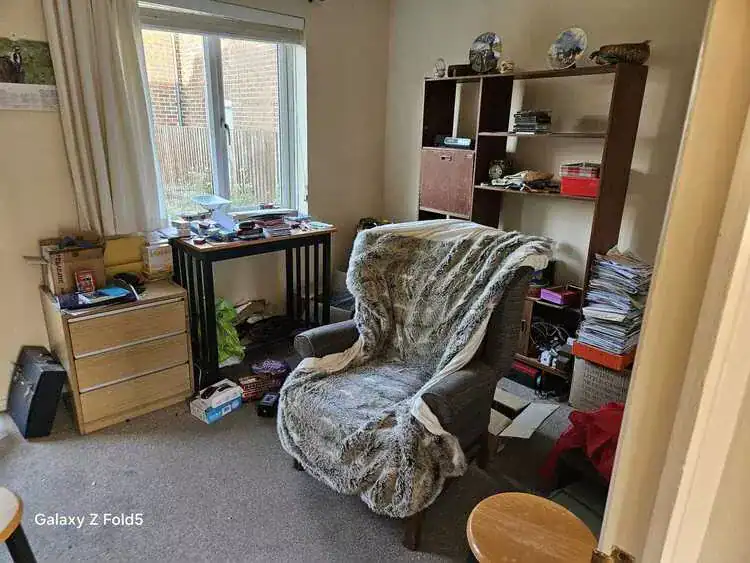 Cluttered room before clearance in Potters Bar, Hertfordshire
