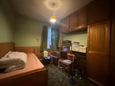 Cluttered room before clearance in Stevenage, Hertfordshire