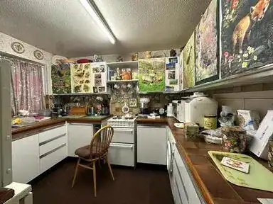 Cluttered room before clearance in Hertford, Hertfordshire