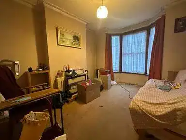 Cluttered room before clearance in Hemel Hempstead, Hertfordshire