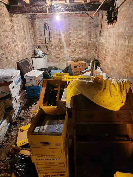 Cluttered room before clearance in Islington, North London