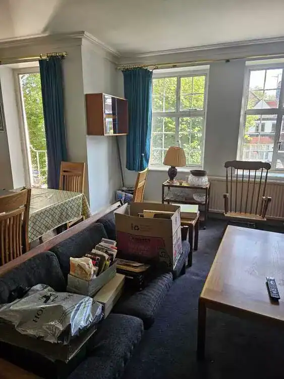 Cluttered room before clearance in Barnet, North London