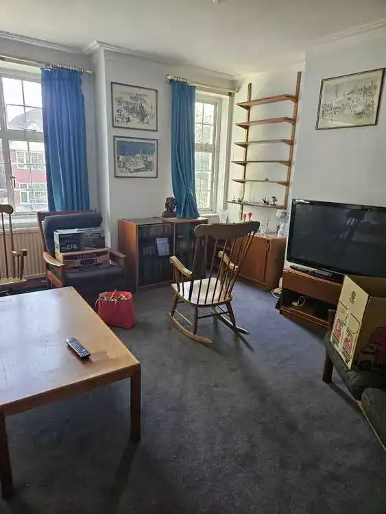 Cluttered room before clearance in St Albans, Hertfordshire